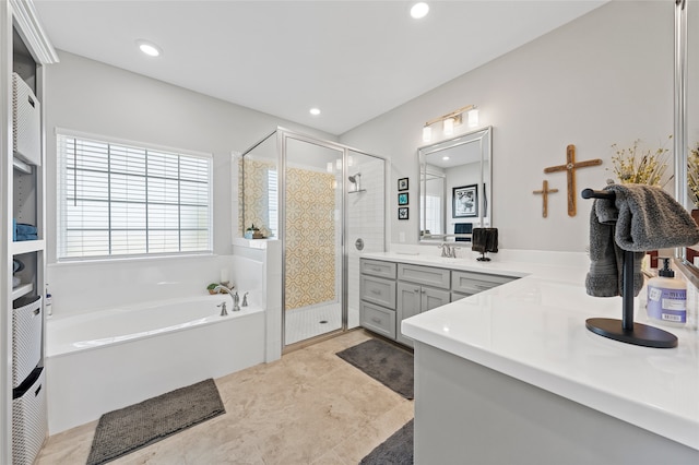386 Frederick Dr, Robinson, TX 76706 - full bathroom with vanity, a garden tub, a shower stall, and recessed lighting