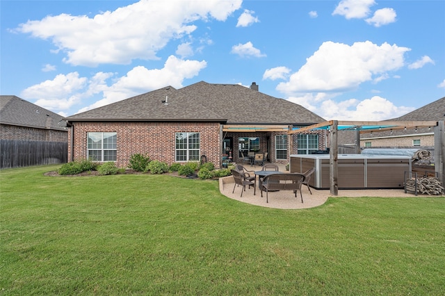 386 Frederick Dr, Robinson, TX 76706 - rear view of house with a hot tub, a patio, brick siding, a shingled roof, and a chimney