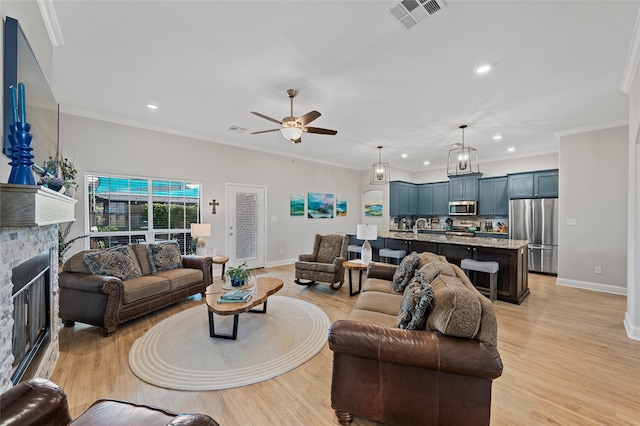 386 Frederick Dr, Robinson, TX 76706 - living room featuring recessed lighting, ceiling fan, a fireplace, light wood-style flooring, and baseboards