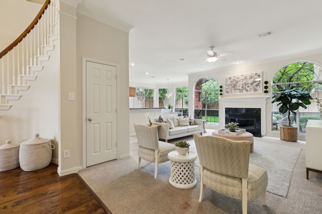 6305 Glenhollow Dr, Plano, TX 75093 - living room featuring a ceiling fan, crown molding, wood finished floors, a fireplace, and baseboards