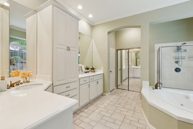 6305 Glenhollow Dr, Plano, TX 75093 - full bathroom featuring ornamental molding, vanity, a whirlpool tub, recessed lighting, and a shower stall