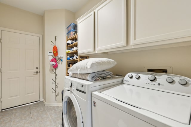 6305 Glenhollow Dr, Plano, TX 75093 - laundry room featuring cabinet space, washing machine and dryer, light tile patterned floors, and baseboards