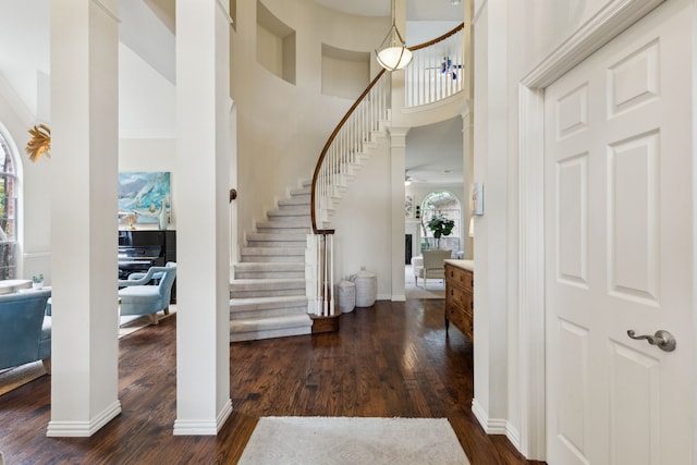 6305 Glenhollow Dr, Plano, TX 75093 - foyer with a towering ceiling, dark wood-style flooring, stairway, and healthy amount of natural light