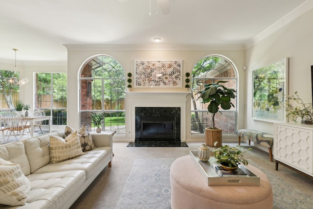 6305 Glenhollow Dr, Plano, TX 75093 - living area with carpet, ornamental molding, a high end fireplace, plenty of natural light, and ceiling fan