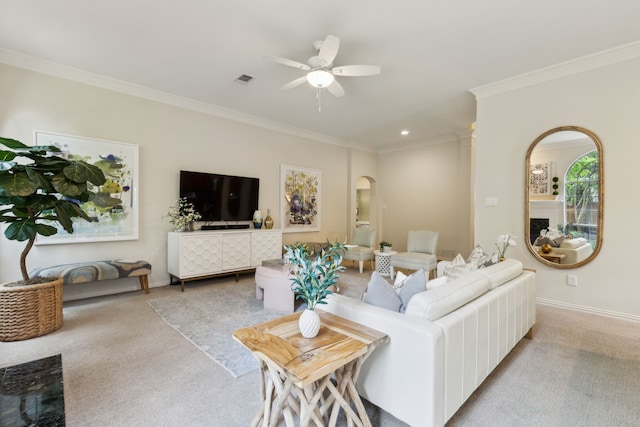 6305 Glenhollow Dr, Plano, TX 75093 - living area featuring arched walkways, carpet floors, ornamental molding, ceiling fan, and baseboards