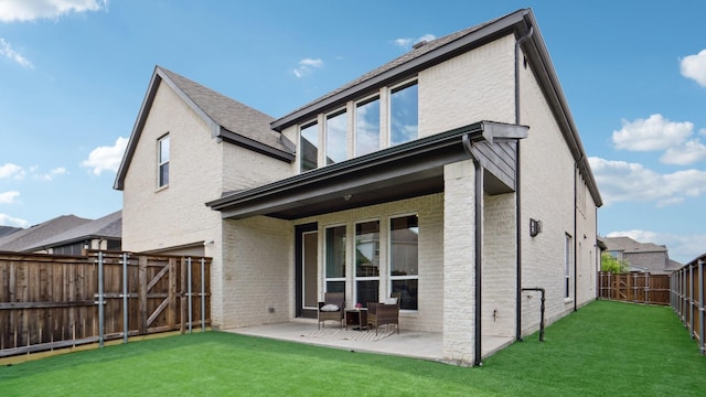 15270 Catalpa Rd, Frisco, TX 75035 - back of house featuring a patio, brick siding, and a gate