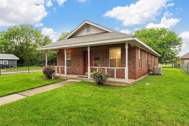 600 Calumet St, Waco, TX 76704 - view of front of home featuring brick siding, a porch, central air condition unit, and roof with shingles