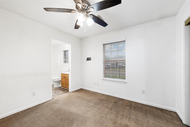 600 Calumet St, Waco, TX 76704 - unfurnished bedroom featuring light carpet, baseboards, ensuite bath, and ceiling fan