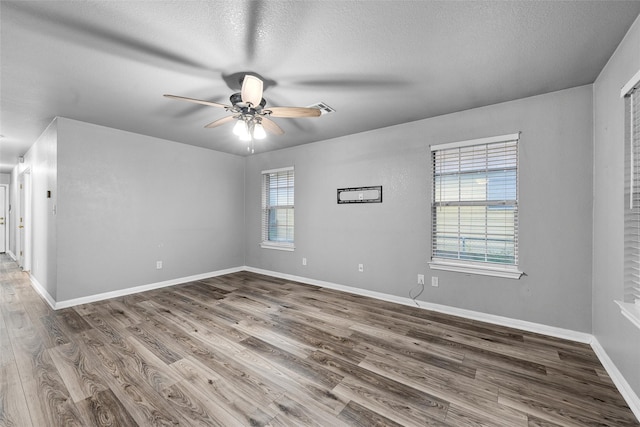600 Calumet St, Waco, TX 76704 - empty room with ceiling fan, wood finished floors, baseboards, and a textured ceiling