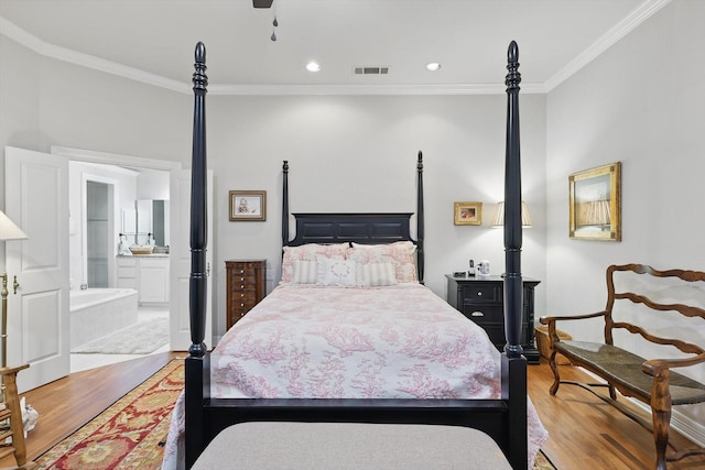 3833 Montecito Dr, Denton, TX 76205 - bedroom featuring light wood-style floors, crown molding, ensuite bath, and recessed lighting