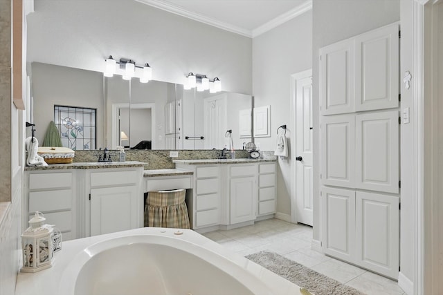 3833 Montecito Dr, Denton, TX 76205 - ensuite bathroom with tile patterned floors, vanity, ornamental molding, and a tub with jets
