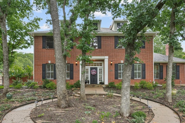 3833 Montecito Dr, Denton, TX 76205 - colonial inspired home featuring brick siding and a shingled roof