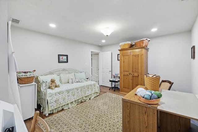 3833 Montecito Dr, Denton, TX 76205 - bedroom featuring wood finished floors and recessed lighting