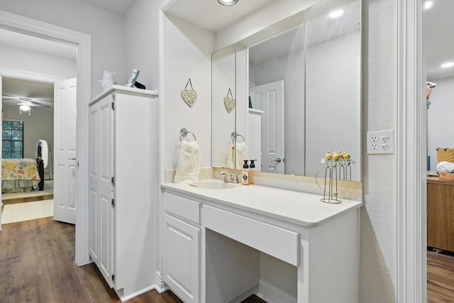 3833 Montecito Dr, Denton, TX 76205 - ensuite bathroom with vanity, wood finished floors, and a ceiling fan