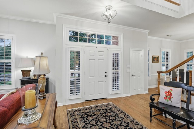 3833 Montecito Dr, Denton, TX 76205 - entrance foyer with wood finished floors, ornamental molding, and baseboards
