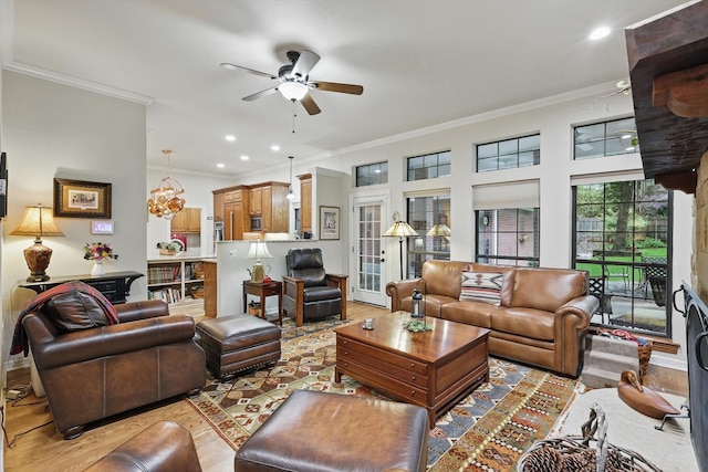 3833 Montecito Dr, Denton, TX 76205 - living area with light wood finished floors, crown molding, a ceiling fan, and recessed lighting
