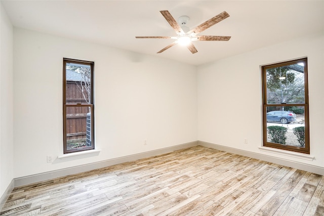 1705 Danube Ln, Plano, TX 75075 - unfurnished room with light wood-type flooring, a ceiling fan, and baseboards