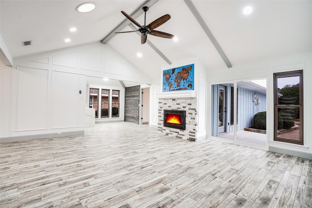 1705 Danube Ln, Plano, TX 75075 - unfurnished living room featuring a warm lit fireplace, light wood-style floors, a ceiling fan, recessed lighting, and healthy amount of natural light