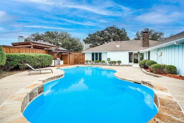 1705 Danube Ln, Plano, TX 75075 - view of swimming pool featuring a patio area, a fenced backyard, and a pergola