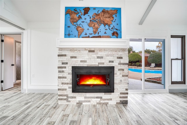 1705 Danube Ln, Plano, TX 75075 - detailed view of wood finished floors and a fireplace