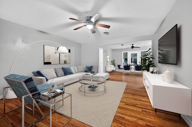 1306 Blanton Pl, Sherman, TX 75092 - living room with ceiling fan, wood finished floors, and a textured ceiling