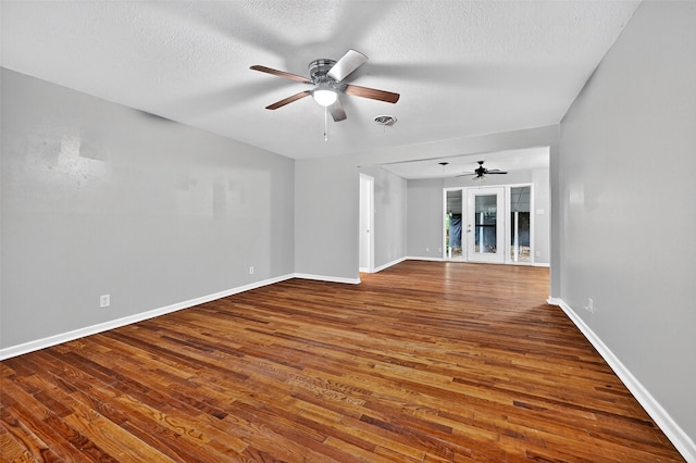 1306 Blanton Pl, Sherman, TX 75092 - spare room featuring a ceiling fan, wood finished floors, and a textured ceiling