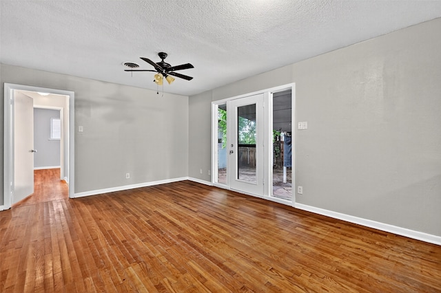 1306 Blanton Pl, Sherman, TX 75092 - empty room with hardwood / wood-style floors, ceiling fan, and a textured ceiling