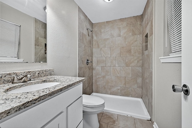 1306 Blanton Pl, Sherman, TX 75092 - full bathroom with vanity, tiled shower, tile patterned flooring, and a textured wall
