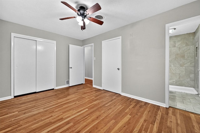 1306 Blanton Pl, Sherman, TX 75092 - unfurnished bedroom with light wood-style floors, connected bathroom, ceiling fan, and a closet