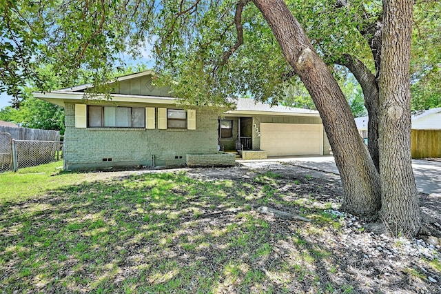 1306 Blanton Pl, Sherman, TX 75092 - view of front facade with brick siding, crawl space, a garage, driveway, and board and batten siding