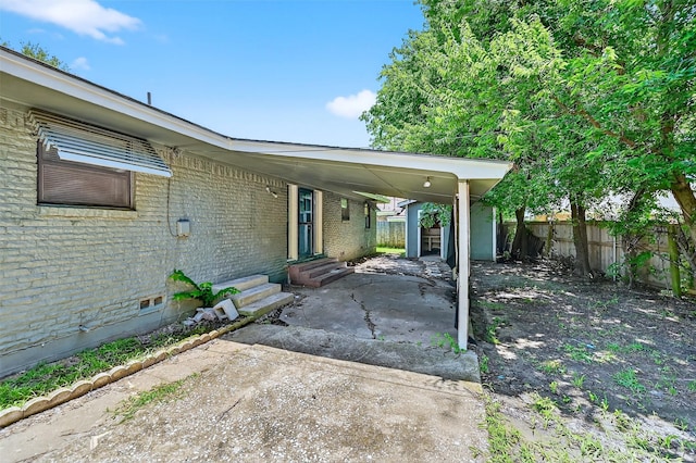 1306 Blanton Pl, Sherman, TX 75092 - view of patio with entry steps and an attached carport