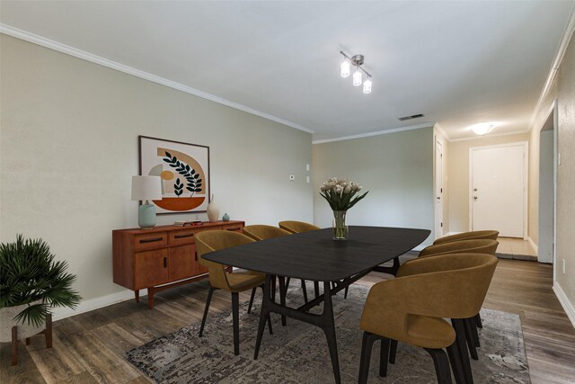 801 Northshore Dr, Garland, TX 75040 - dining room with dark wood-type flooring, ornamental molding, and baseboards