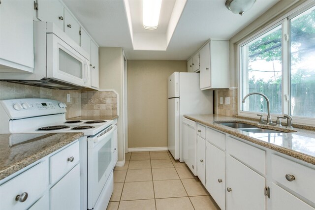 801 Northshore Dr, Garland, TX 75040 - kitchen with white appliances, a sink, baseboards, white cabinets, and tasteful backsplash