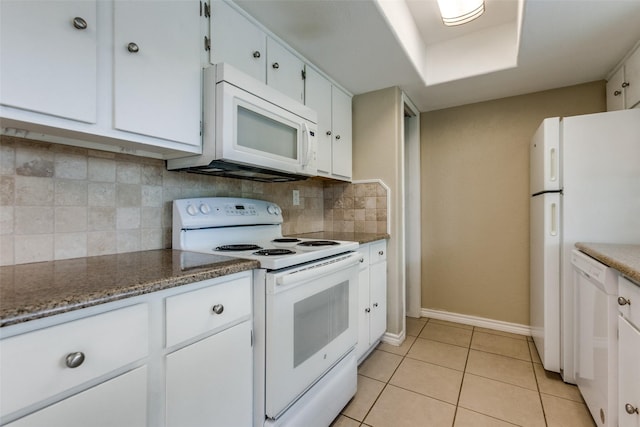 801 Northshore Dr, Garland, TX 75040 - kitchen with white appliances, baseboards, white cabinetry, backsplash, and light tile patterned floors