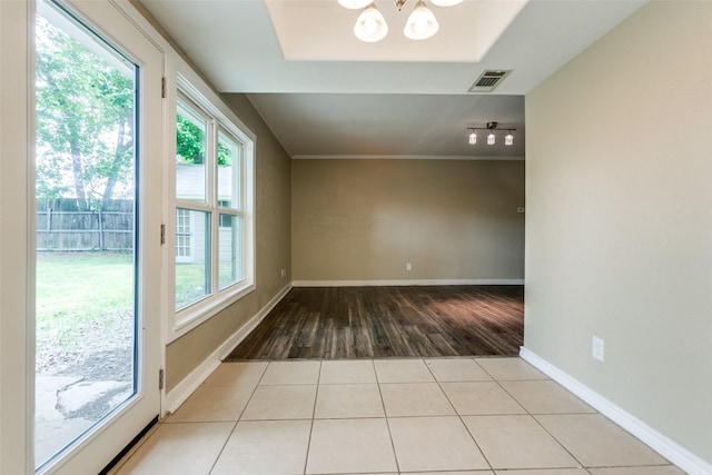801 Northshore Dr, Garland, TX 75040 - unfurnished room featuring wood finished floors, a chandelier, and baseboards