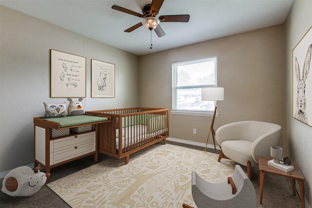 801 Northshore Dr, Garland, TX 75040 - bedroom featuring baseboards, a nursery area, and carpet floors