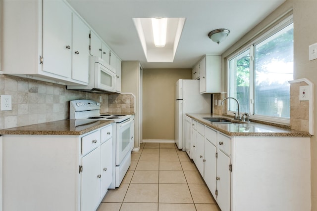 801 Northshore Dr, Garland, TX 75040 - kitchen featuring white appliances, a sink, white cabinets, and decorative backsplash