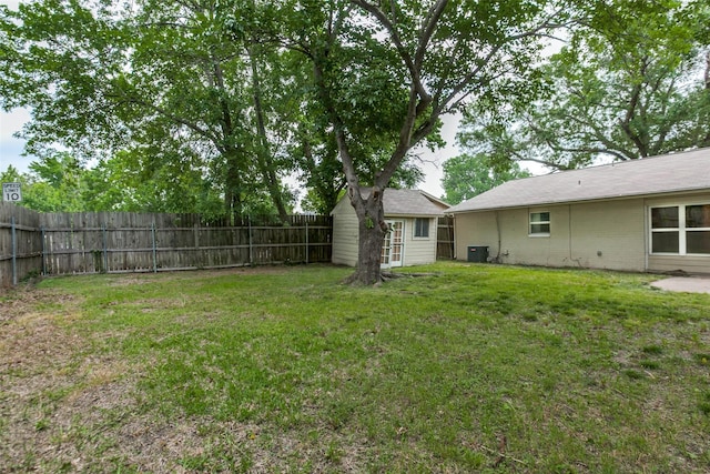 801 Northshore Dr, Garland, TX 75040 - view of yard with central AC and an outbuilding