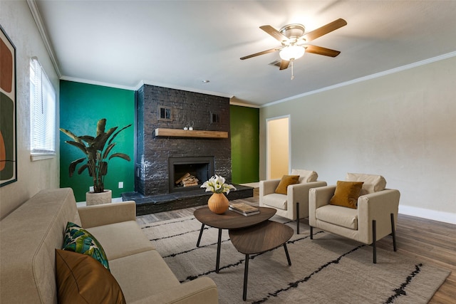 801 Northshore Dr, Garland, TX 75040 - living area with wood finished floors, crown molding, ceiling fan, a stone fireplace, and baseboards