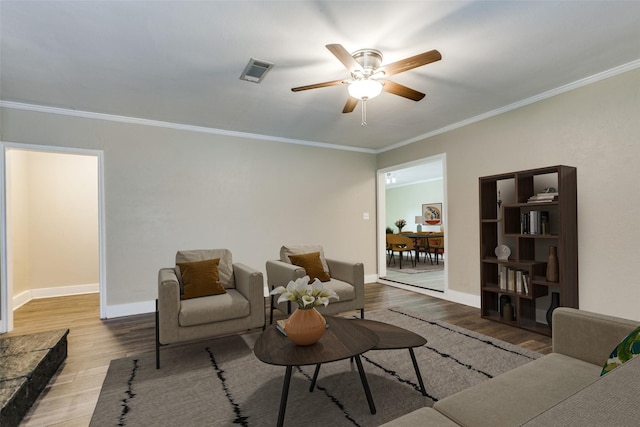801 Northshore Dr, Garland, TX 75040 - living area featuring wood finished floors, ceiling fan, crown molding, and baseboards