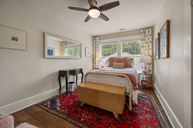 2307 5th Ave, Fort Worth, TX 76110 - bedroom with baseboards, wood finished floors, and a ceiling fan