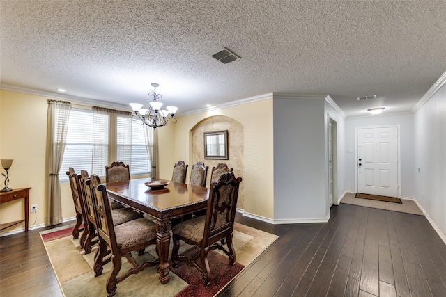 5504 Cedar Mountain Dr, Mckinney, TX 75071 - dining room with a chandelier, dark wood-style flooring, a textured ceiling, ornamental molding, and baseboards