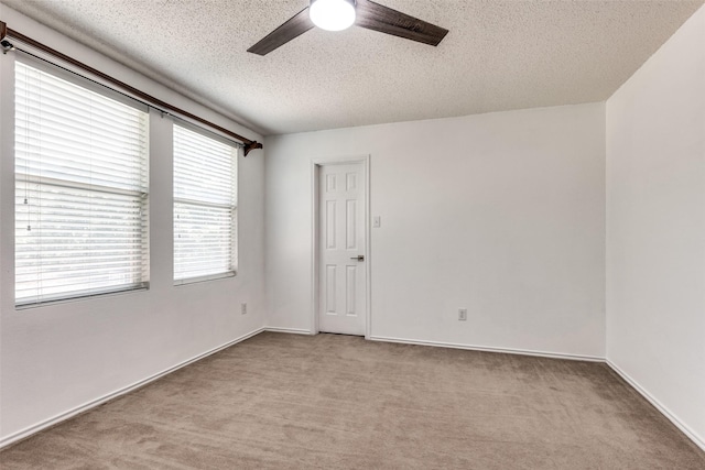 5504 Cedar Mountain Dr, Mckinney, TX 75071 - carpeted spare room featuring a textured ceiling and a ceiling fan