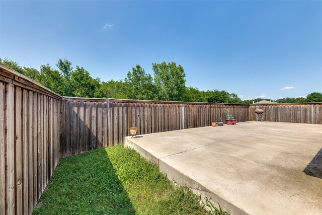 5504 Cedar Mountain Dr, Mckinney, TX 75071 - fenced backyard with a patio area