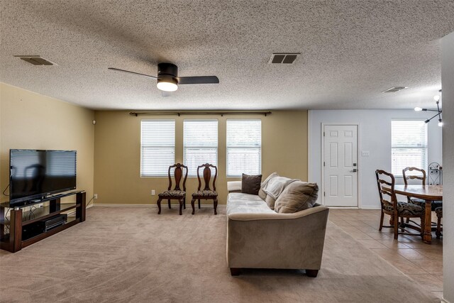 5504 Cedar Mountain Dr, Mckinney, TX 75071 - living area with a ceiling fan, baseboards, and a textured ceiling
