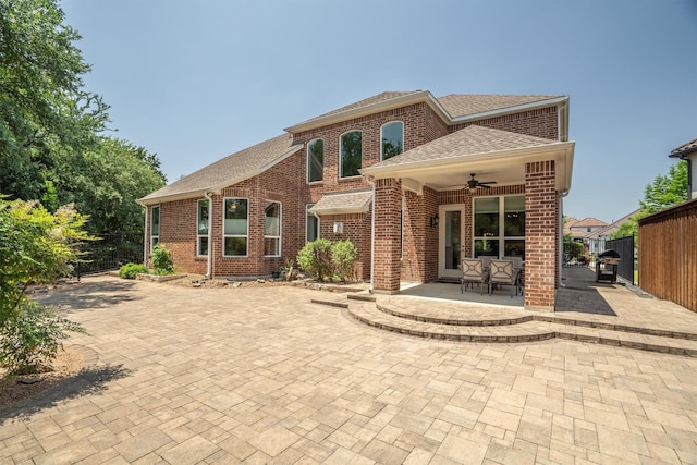 2021 Lake Vista Ct, Southlake, TX 76092 - back of property featuring a ceiling fan, roof with shingles, brick siding, and a patio area