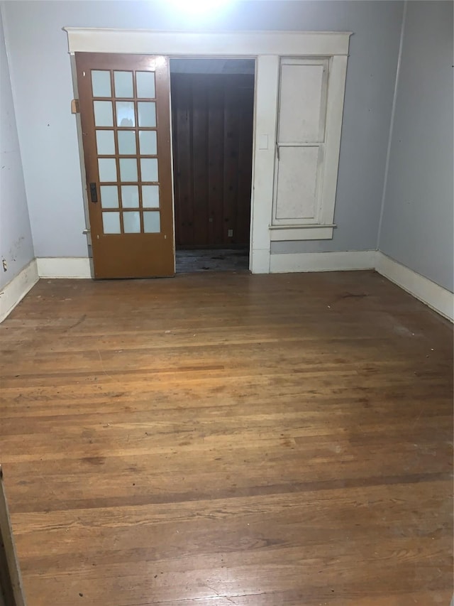 1602 Mitchell Ave, Waco, TX 76708 - spare room featuring hardwood / wood-style floors and baseboards