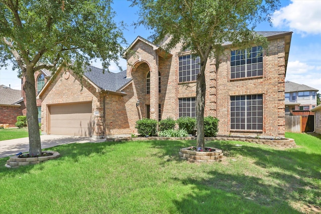 12428 Leaflet Dr, Fort Worth, TX 76244 - traditional home featuring brick siding, an attached garage, and driveway