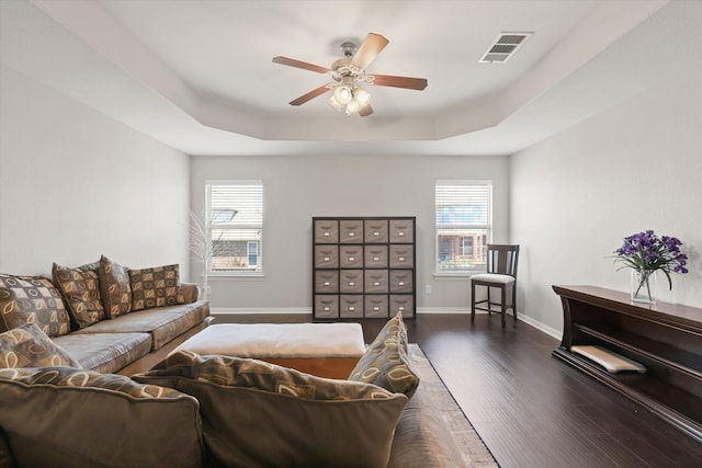 12428 Leaflet Dr, Fort Worth, TX 76244 - living area with a tray ceiling, dark wood-type flooring, ceiling fan, and plenty of natural light