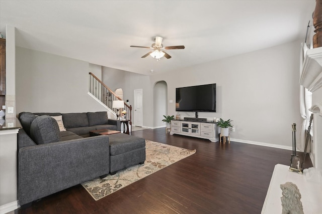 12428 Leaflet Dr, Fort Worth, TX 76244 - living area featuring ceiling fan, arched walkways, stairs, dark wood-style flooring, and baseboards